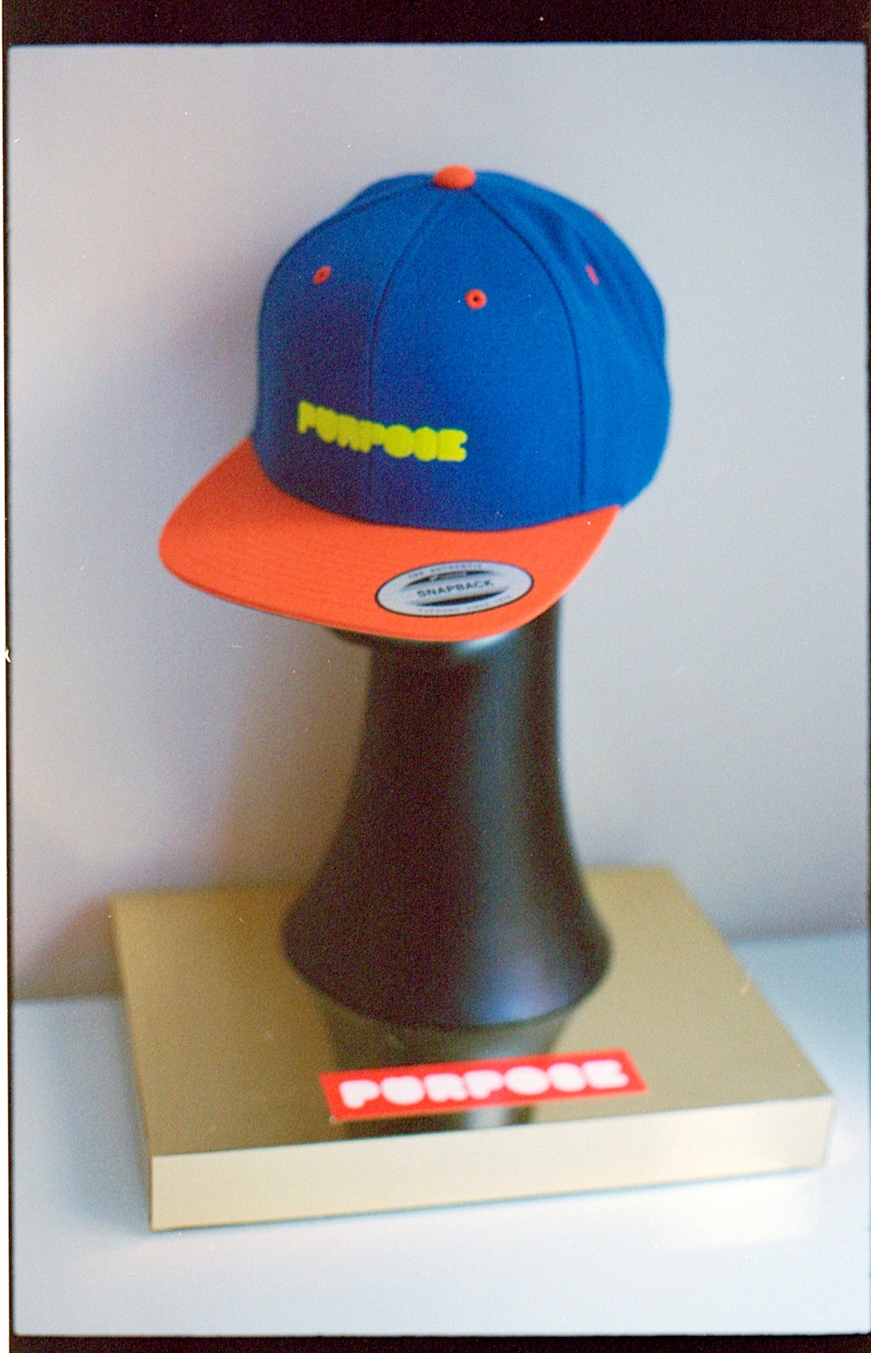 PURPOSE.BLUE AND ORANGE SNAPBACK HAT